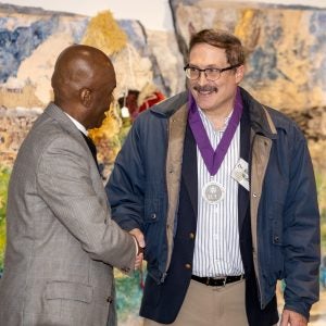 Dr. Grant Hayes & Dr. Ed Wall shake hands